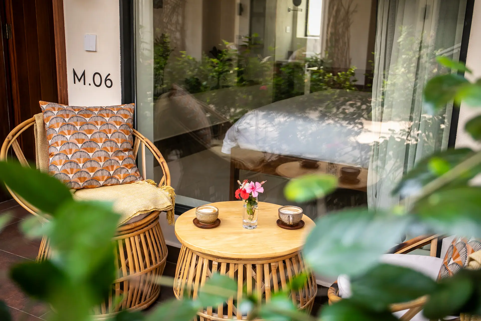 Meditator room private terrace with rattan chairs and morning coffee