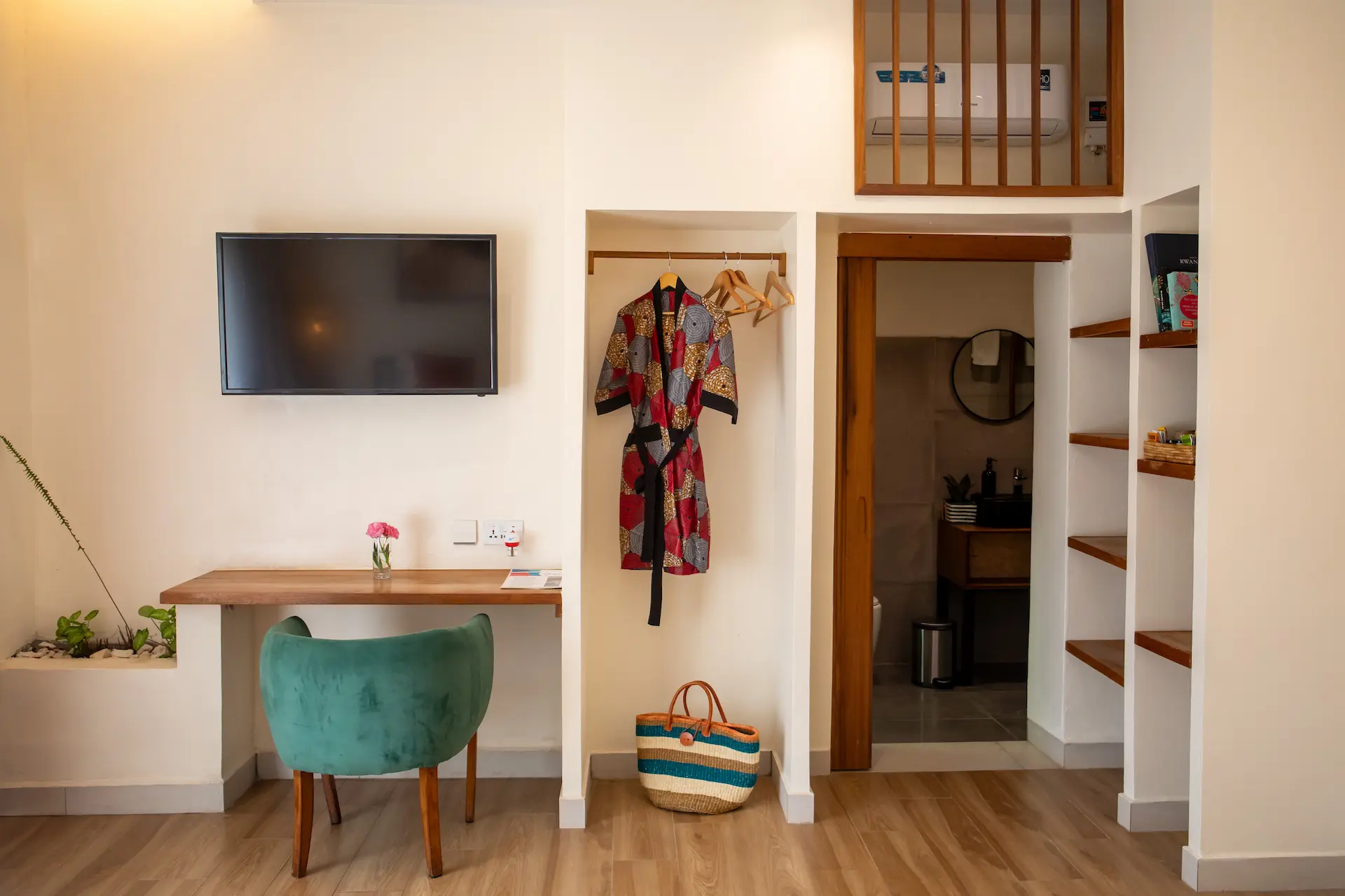 Creative room â€” TV wall, wardrobe and green velvet chair